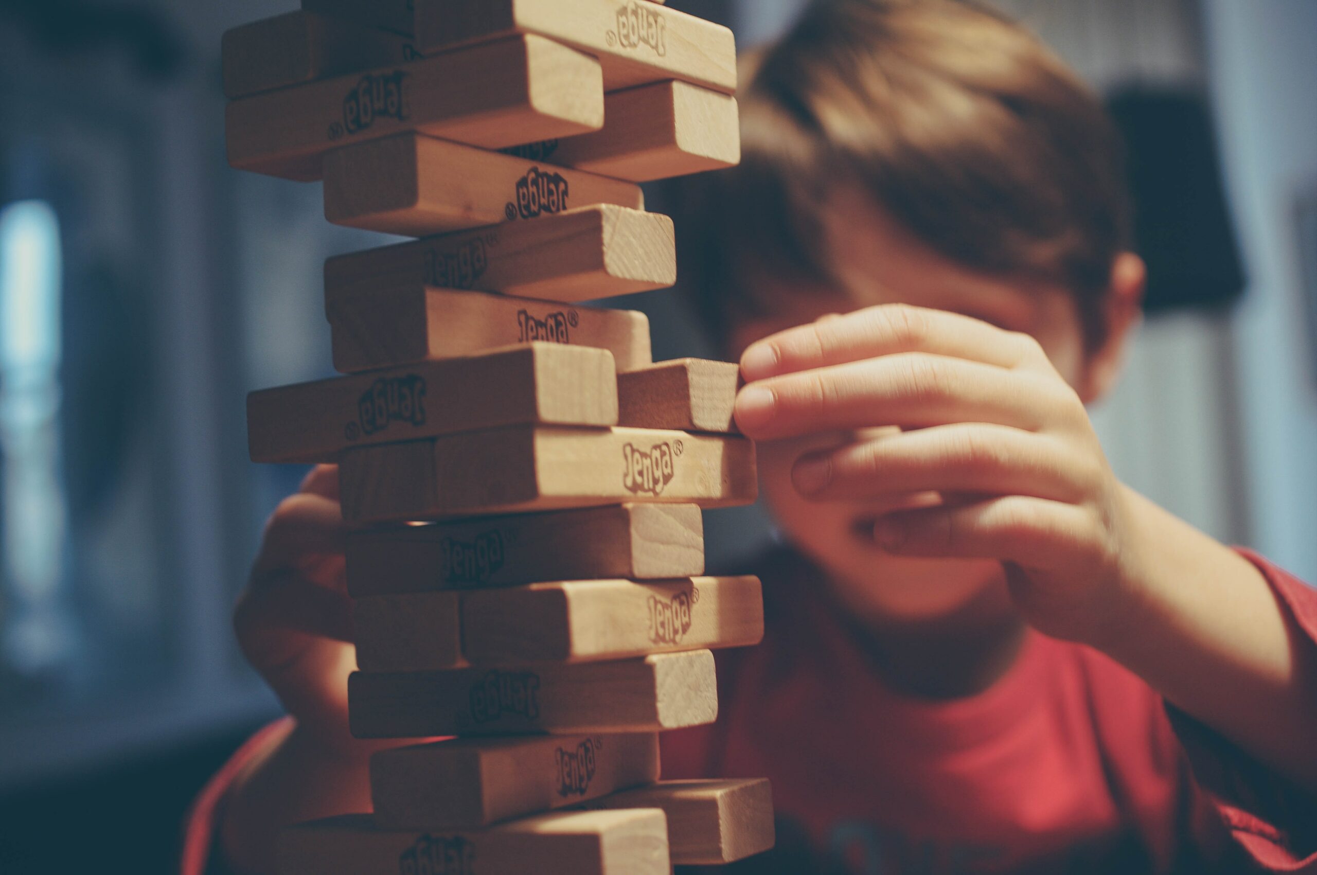 boy playing game with sticks